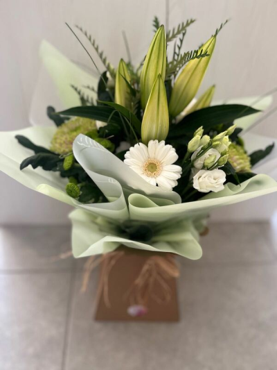 Evelyn - A fabulous collection of white and cream flowers make this the perfect gift. This bouquet will be hand delivered by the local florist.
