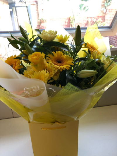 Sunrise - Energise their day with a stunning surprise. A warm collection of seasonal flowers artistically arranged by an artistic florist.