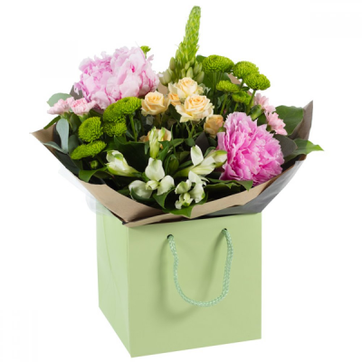 Delicate Touch - Subtle and sweet is the aura of this handtied. Containing a mixed collection of seasonal flowers and peonies.